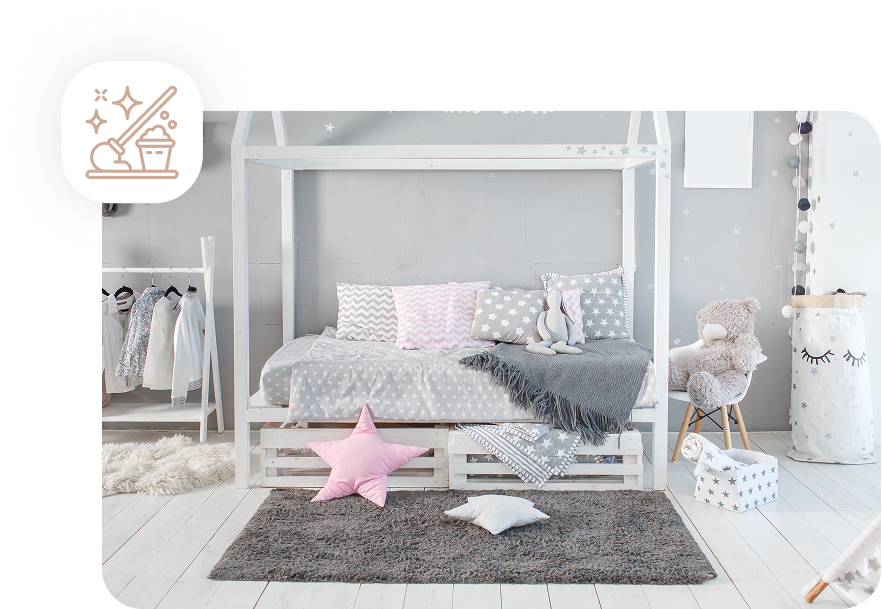 A clean and tidy child's bedroom with a white house-frame bed and neatly arranged pillows, representing a regular cleaning service.